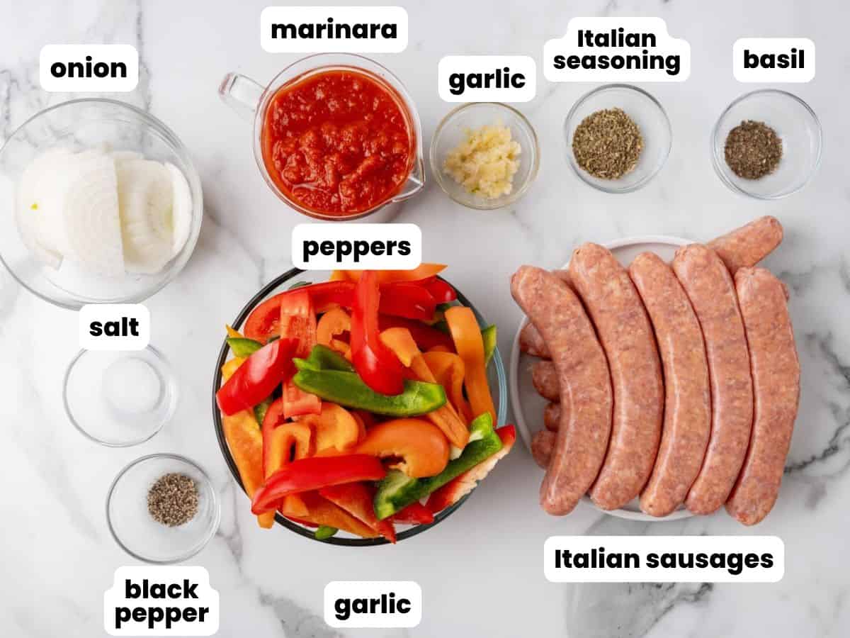 Ingredients needed to make easy sausage and peppers in slow cooker with marinara sauce.