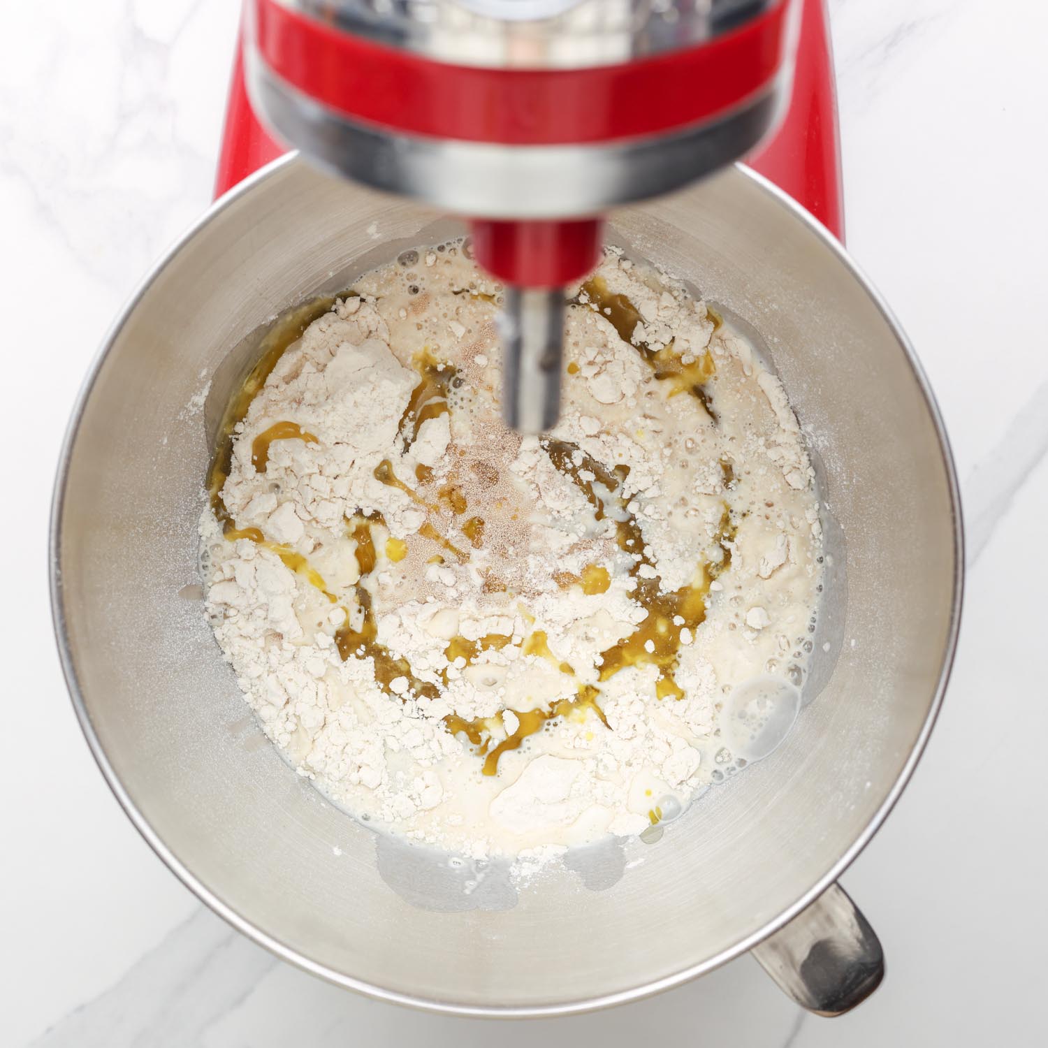 flour, yeast in a stand mixer with warm milk and olive oil added. 