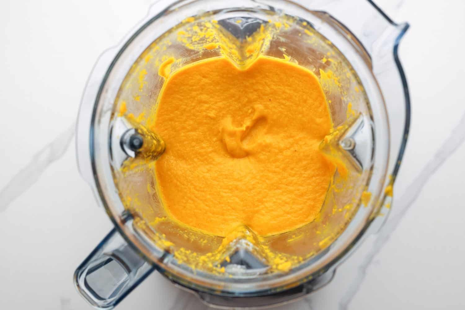 Carrot souffle mixture in a blender jug