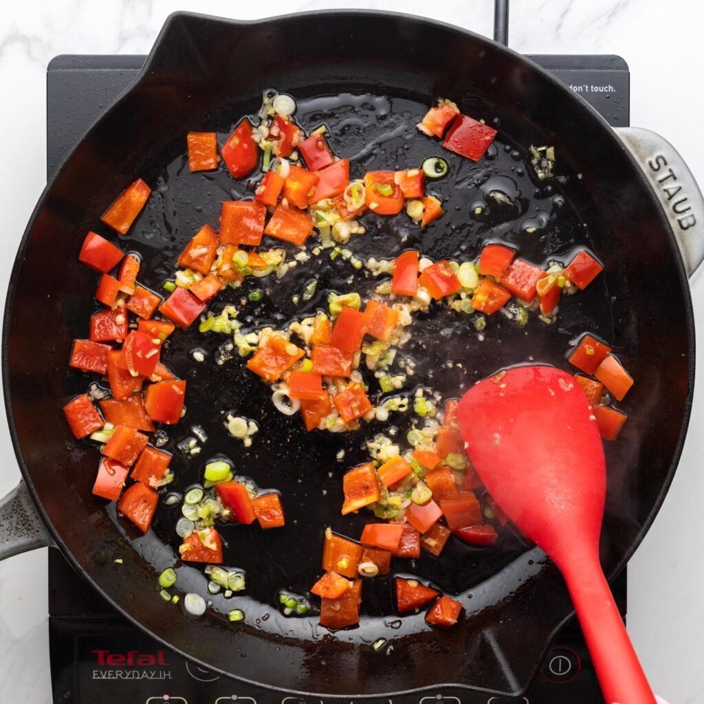 a cast iron skillet filled with Thai pineapple fried rice.