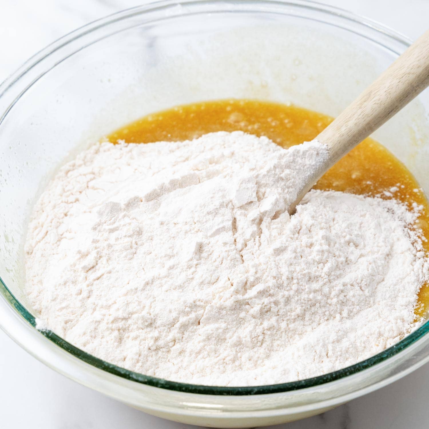 Dry ingredients added to wet ingredients to make blondies.