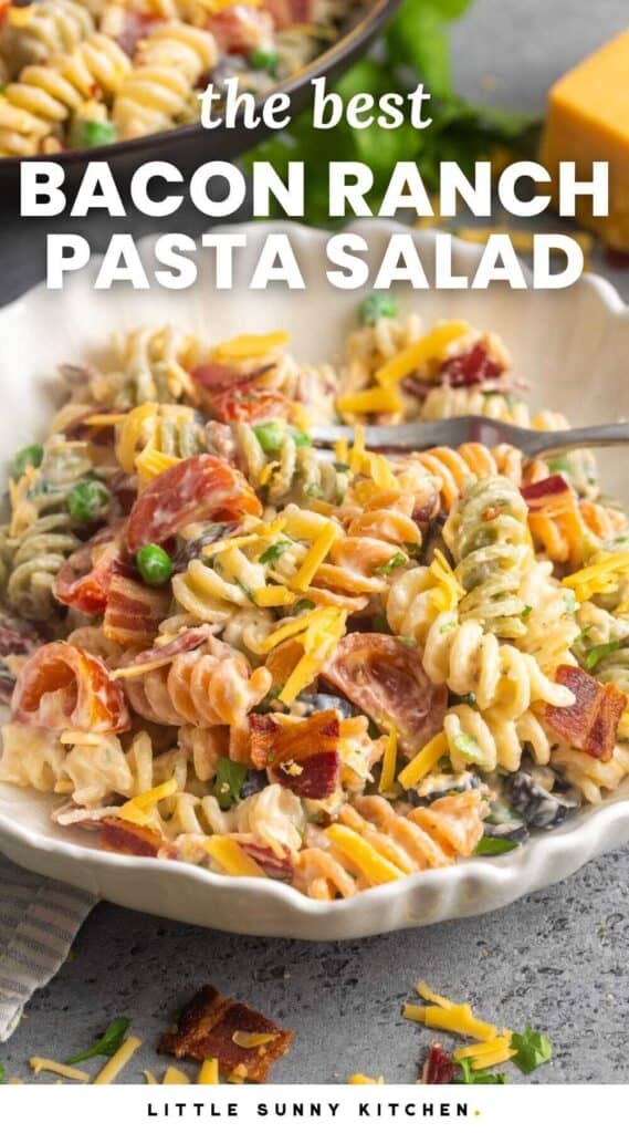 a bowl of pasta salad with tricolor rotini. Text overlay says 