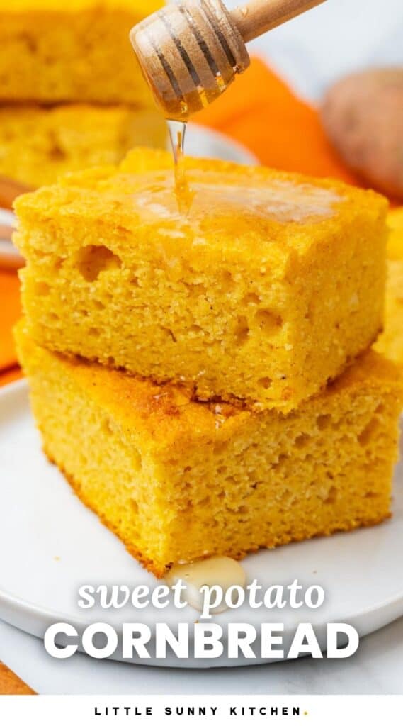 two squares of sweet potato cornbread on a plate. Honey is drizzled over top. Text overlay says 